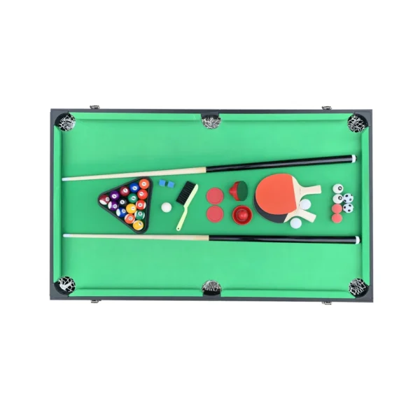 Pool accessories on green felt: cues, balls, paddles, brush
